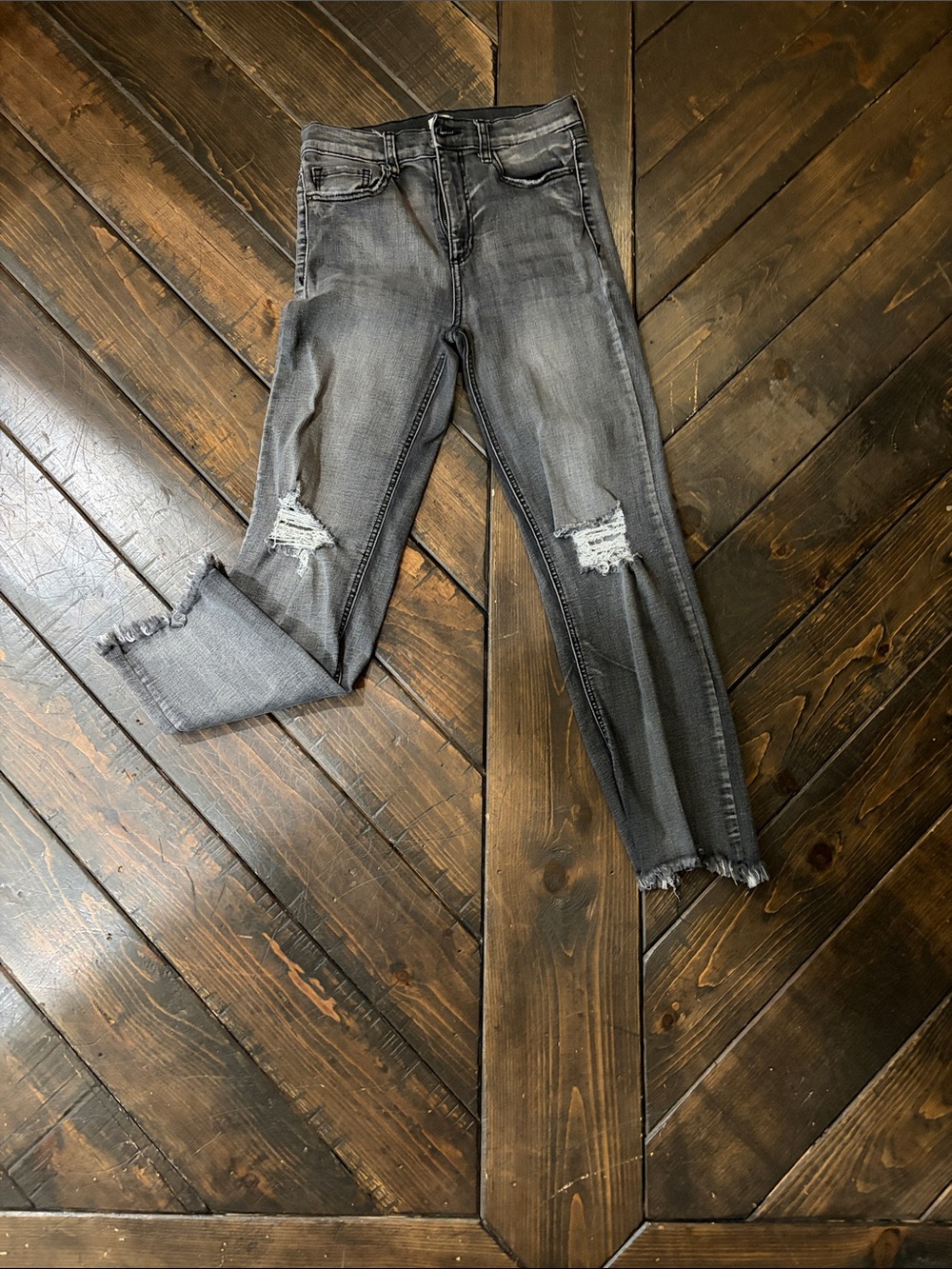 Sneak Peek Distressed Gray Women's Jeans with frayed bottoms.